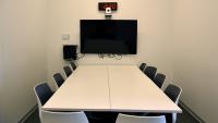 Debriefing room with monitor, PC, web camera for video-conferencing.